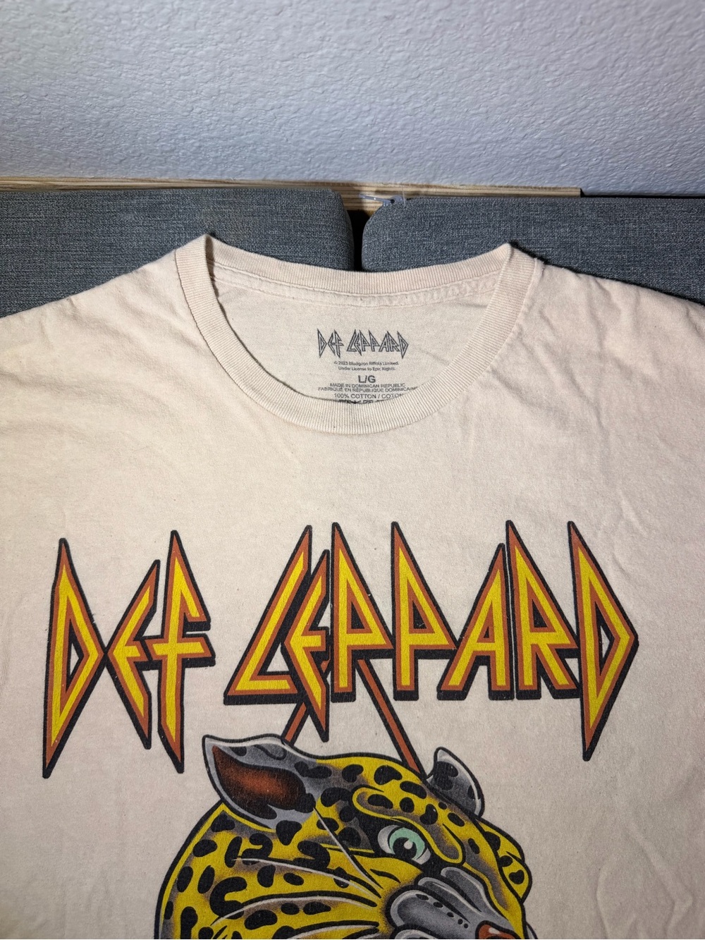 Def Leppard Women's Cream Short Sleeve Graphic Tee with Yellow/Orange Band Logo